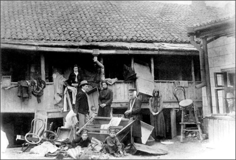 Pogrom victims in front of a vandalized house in the Bessarabian city of Kishinev, on the southwestern edge of the Russian Empire, April 1903.